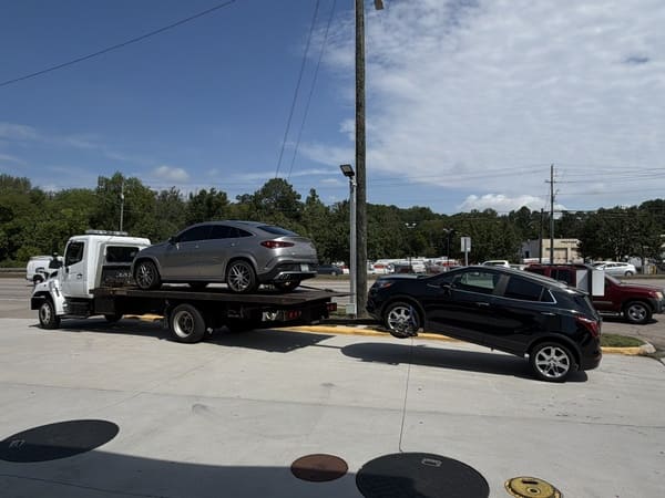 KM Towing working on a pickup truck