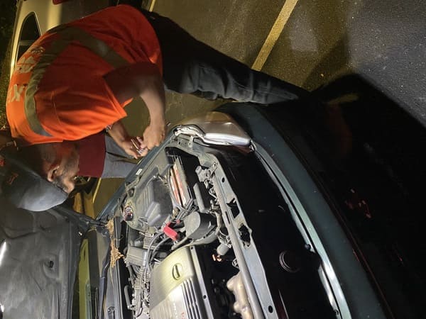 Roadside engine work being performed at night